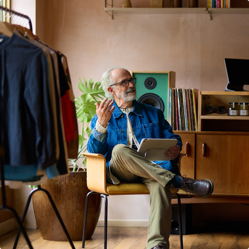 Person sitting on a chair in a shop